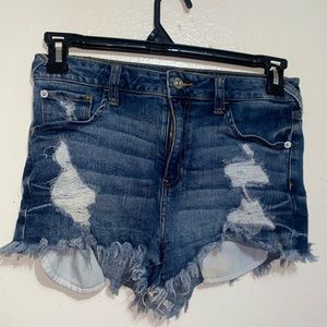Medium wash front pocket showing denim shorts